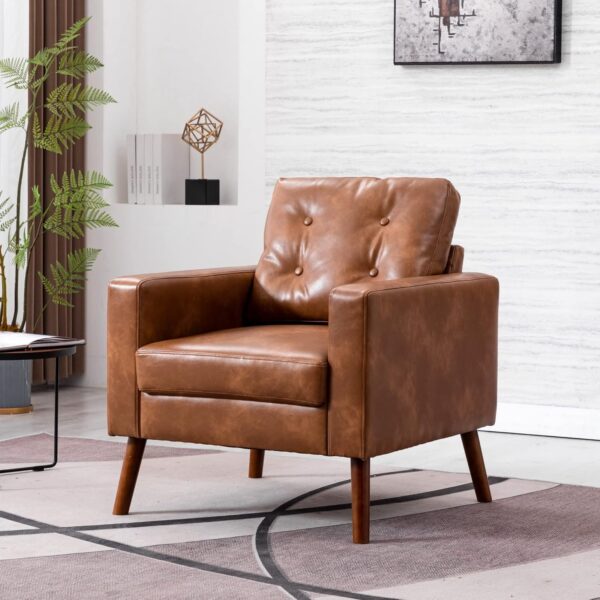 A caramel-colored leather chair with a tufted back, placed in a living room, showcasing a mid-century modern style with wood legs.