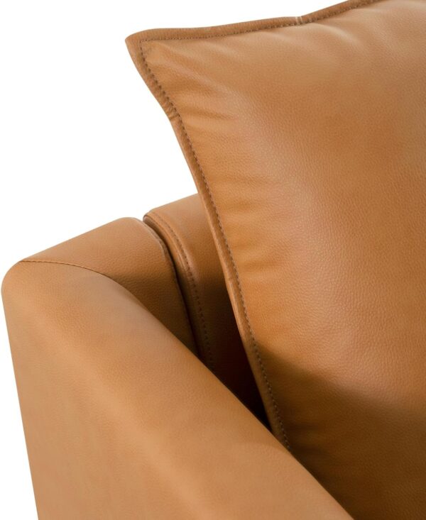 Close-up of a tan leather couch from the Naomi Home Elizabeth Modern DIY Collection, showcasing its sleek design and texture.