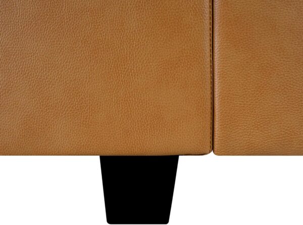 Close-up of a tan leather couch with black legs, part of the Naomi Home Elizabeth Modern DIY Collection, designed for versatility.